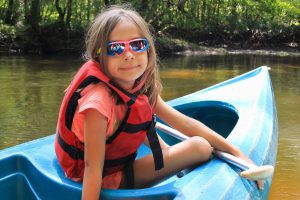 Girl kayaking in the Pine Barrens of New Jersey